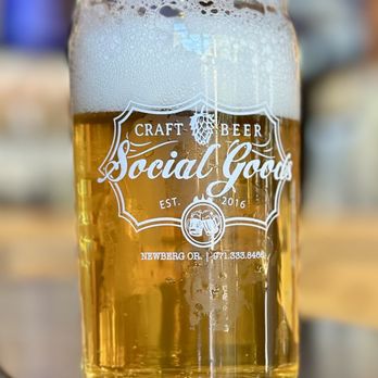 Social Goods - a glass of beer on a table - Beer, Wine & Spirits Near Me - Newberg, Oregon Social Goods - a glass of beer on a table - Beer, Wine & Spirits Near Me - Newberg, Oregon