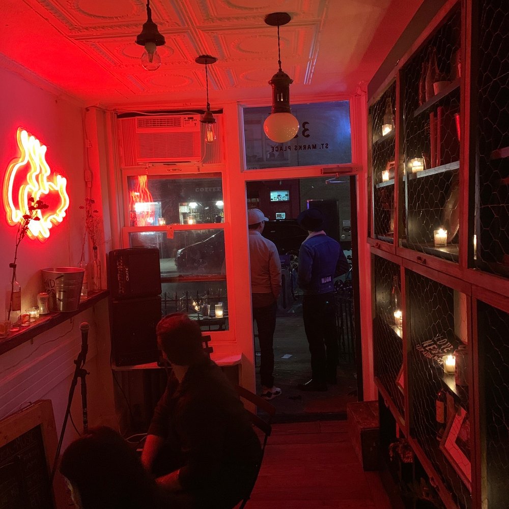 Bar Illegal - a man sitting in a chair in a dimly lit room - Bars Near Me - New York, New York Bar Illegal - a man sitting in a chair in a dimly lit room - Bars Near Me - New York, New York