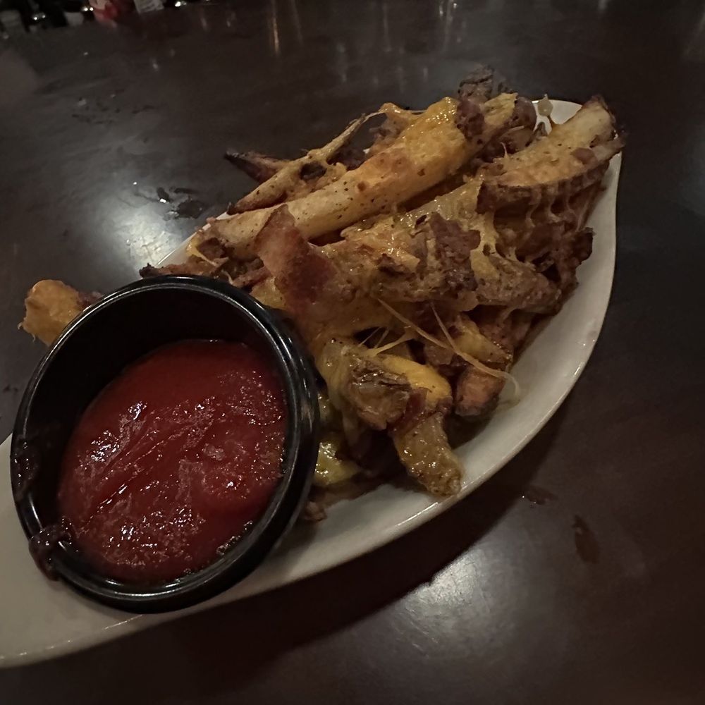 Chips with bacon and cheese! Our appetizer and very yummy.
