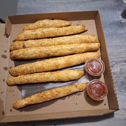 Mick's Pizza - Had to order a side of bread sticks. They are huge. Had to cut all of them in half. Still plenty of leftovers.