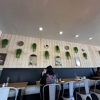 Papas and Eggs - a woman sitting at a table in a restaurant - Breakfast & Brunch Near Me - San Jose, California Papas and Eggs - a woman sitting at a table in a restaurant - Breakfast & Brunch Near Me - San Jose, California