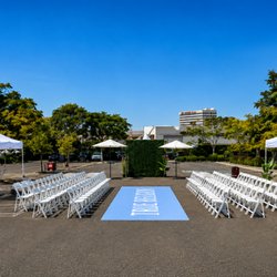 Tlapazola Event Rentals - Outdoor event setup with white seating, canopies and professional event installation.