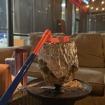 O2 Hookah Cafe - a baseball bat on a table - Hookah Bars Near Me - Houston, Texas