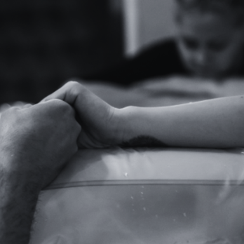 BWS Doulas - Client in labor with doula nearby - Childbirth Education Near Me