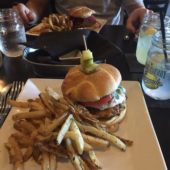The Bog Tavern - Salmon burger with Parmesan truffle fries and a huckleberry lemonade - New American Near Me - Bourne, Massachusetts