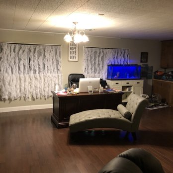 Budget Floors - a living room with a desk and a chair - Flooring Near Me - Amarillo, Texas Budget Floors - a living room with a desk and a chair - Flooring Near Me - Amarillo, Texas
