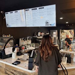 Brew47 - Current counter and original menu under development and changes (that's Brandon, the new owner at the espresso machine)