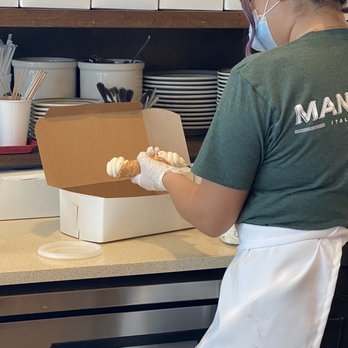 Mandola's Italian Kitchen - Making fresh cannolis to take home! - Italian Near Me - Riverview, Florida