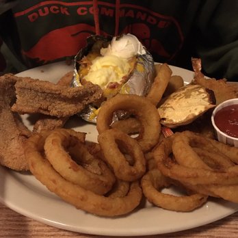 Catfish Galley - Sampler plate with cat fish, onion rings, baked potato, stuffed crab and shrimp - Seafood Near Me - Jackson, Tennessee Catfish Galley - Sampler plate with cat fish, onion rings, baked potato, stuffed crab and shrimp - Seafood Near Me - Jackson, Tennessee