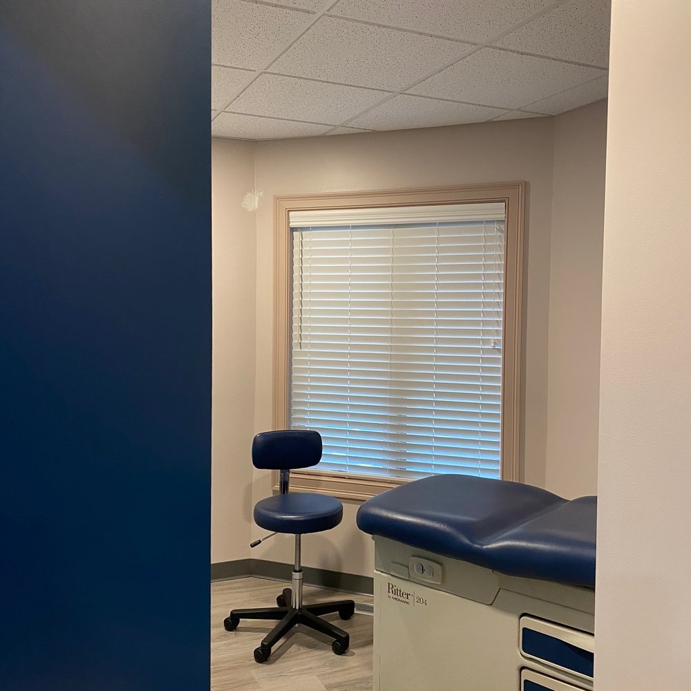 Valle Group - a medical exam room with blue walls - General Contractors Near Me - East Falmouth, Massachusetts Valle Group - a medical exam room with blue walls - General Contractors Near Me - East Falmouth, Massachusetts