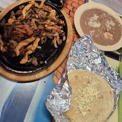 Juanito's Street Tacos - Fajita Texas chicken steak an he swapped shrimp for chorizo beans an tortillas