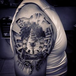 Tattoo Image - Egyptian pyramid with roman numeral clock, black birds sky and fillagree