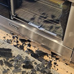 Miele Princeton Experience Center - EXPLODED Miele Range Door in large shards