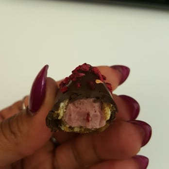 Neuhaus - Raspberry  "Seduction". Dark chocolate and a crispy nougat shell encasing a creamy and delicious raspberry filling. - Candy Stores Near Me - Washington, DC, District of Columbia