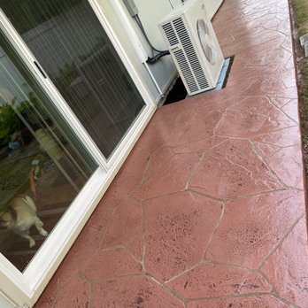 Unlimited Landscape Hawaii - After shot of side of house with stamped, stained and sealed decorative concrete overlay blended into new slab. - Lawn Services Near Me