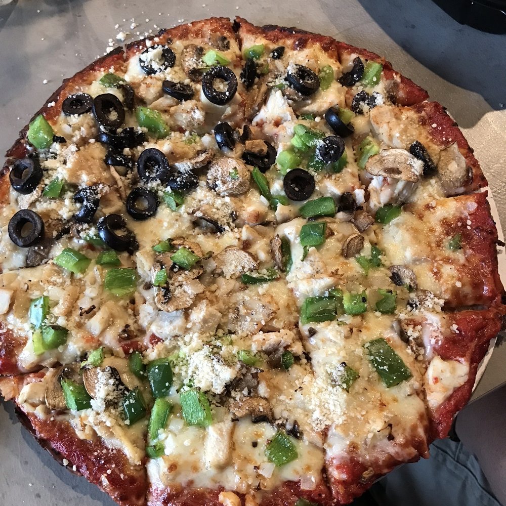 Veggie pizza, added chicken with olives on half , all on a cauliflower crust. Veggie pizza, added chicken with olives on half , all on a cauliflower crust.
