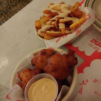 La Cubana - Yuka Frita (top- plain, not too exciting) and conch fritters (bottom- delicious) - Cuban Near Me - Toronto, Ontario La Cubana - Yuka Frita (top- plain, not too exciting) and conch fritters (bottom- delicious) - Cuban Near Me - Toronto, Ontario