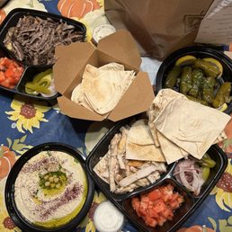 Hummus, yalanji (grape leave appetizer), beef shawarma w/rice & chicken shawarma w/Iraqi bread.