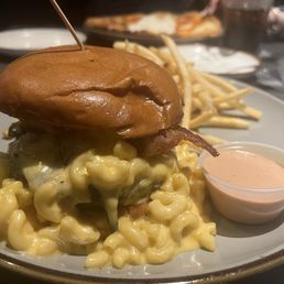 Dr. BBQ burger with brisket and Mac n cheese and shoe string fries! Very good Dr. BBQ burger with brisket and Mac n cheese and shoe string fries! Very good