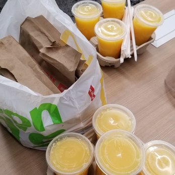 McDonald's - a tray of orange juice and a bag of orange juice - Burgers Near Me - Winston Salem, North Carolina