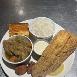 1pc Fried Fish Fillet, Cabbage, White Rice, Cornbread and Hushpuppies w/ Lemon and Homemade Tartar Sauce