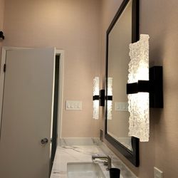 Sandoval Brother’s - Heavy mirror and delicate sconces were taken down and replaced after wallpaper installation.