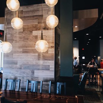 Caribou Coffee - a table and chairs in a restaurant - Coffee & Tea Near Me - White Bear Lake, Minnesota Caribou Coffee - a table and chairs in a restaurant - Coffee & Tea Near Me - White Bear Lake, Minnesota