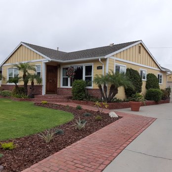 Approved Contractor - House in Torrance remodeled by Approved Contractors using James Hardie board lap siding and batten boards. - Windows Installation Near Me - Canoga Park, California