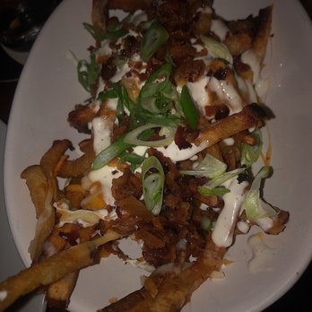 Féile - These loaded fries were too good to be true. Crispy thin fries topped with bacon, ranch, scallions, and shredded cheeses...Yes please - Sports Bars Near Me - New York, New York Féile - These loaded fries were too good to be true. Crispy thin fries topped with bacon, ranch, scallions, and shredded cheeses...Yes please - Sports Bars Near Me - New York, New York