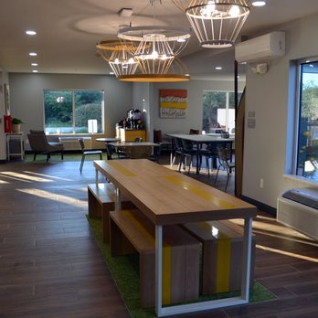 Spark by Hilton Freeport - Tables, desks, chairs, and benches to use for work, socializing, or gaming. - Hotels Near Me - Freeport, Maine Spark by Hilton Freeport - Tables, desks, chairs, and benches to use for work, socializing, or gaming. - Hotels Near Me - Freeport, Maine