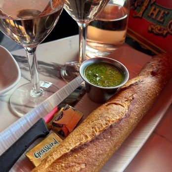 The Stinking Rose - Baguette with garlic pesto dipping sauce. - Italian Near Me - San Francisco, California The Stinking Rose - Baguette with garlic pesto dipping sauce. - Italian Near Me - San Francisco, California