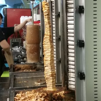 Donair Dude - How the meat is cooked. On an upright rotating stick. - Middle Eastern Near Me - Vancouver, British Columbia Donair Dude - How the meat is cooked. On an upright rotating stick. - Middle Eastern Near Me - Vancouver, British Columbia