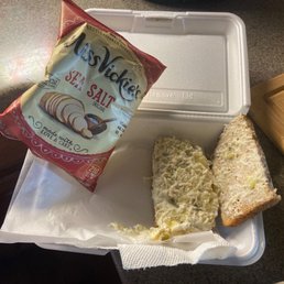 a sandwich and a bag of chips