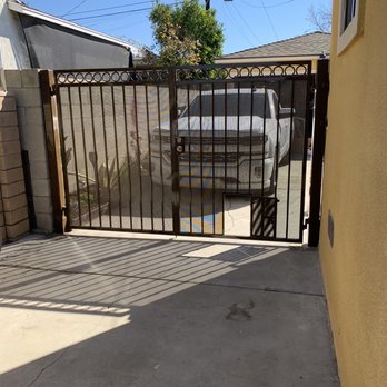 Carrasco Ornamental - Very well made custom double gate with doggie door. - Metal Fabricators Near Me - Pomona, California