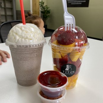Tito's Mexican Snack Bar - Cookies & cream milkshake; 16 oz mango & strawberry fruit cup with chamoy & tajin on the side - Mexican Near Me - Helotes, Texas