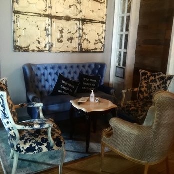 Long Branch Distillery - a living room with a blue couch and chairs - Distilleries Near Me - Long Branch, New Jersey Long Branch Distillery - a living room with a blue couch and chairs - Distilleries Near Me - Long Branch, New Jersey