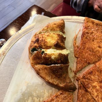 Mamma Lombardi's Restaurant - Calzone with spinach - Italian Near Me - Holbrook, New York Mamma Lombardi's Restaurant - Calzone with spinach - Italian Near Me - Holbrook, New York