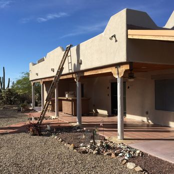 Martinez Custom Painting - Back porch near the start (primer on poles) - Painters Near Me - Tucson, Arizona