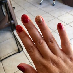 My nails, dipped with this nice wine color and a glittered ring finger.