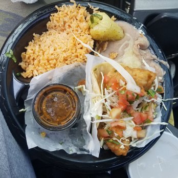 Taco Nazo - Two shrimp tacos "Baja style" with rice and beans. I've devoured one already, and a potato taco waits on it's own plate on the side. - Tacos Near Me - La Puente, California Taco Nazo - Two shrimp tacos "Baja style" with rice and beans. I've devoured one already, and a potato taco waits on it's own plate on the side. - Tacos Near Me - La Puente, California