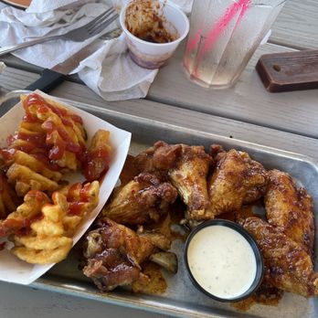 Tiki Bar - chicken wings and fries with ketchup - New American Near Me - Galveston, Texas Tiki Bar - chicken wings and fries with ketchup - New American Near Me - Galveston, Texas
