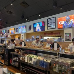 WingHouse Bar & Grill - Tampa Stadium - Bar seating and TVs