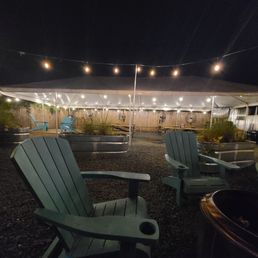 Outdoor, dog-friendly seating with fans and fire pit