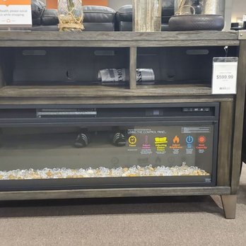 Ashley Store - Picture of how furniture piece was advertised with one price tag and no information behind it. - Furniture Stores Near Me - Orland Park, Illinois