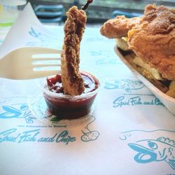 Spud Fish & Chips - Dipping a piece of fish in ketchup!