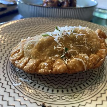 Cafe Americana - Jerk Chicken Empanadas  Cilantro & mint sauce. - Tapas/Small Plates Near Me - Arlington, Texas