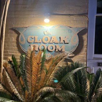 The Cloak Room - a palm tree in front of the sign - Dive Bars Near Me - Austin, Texas