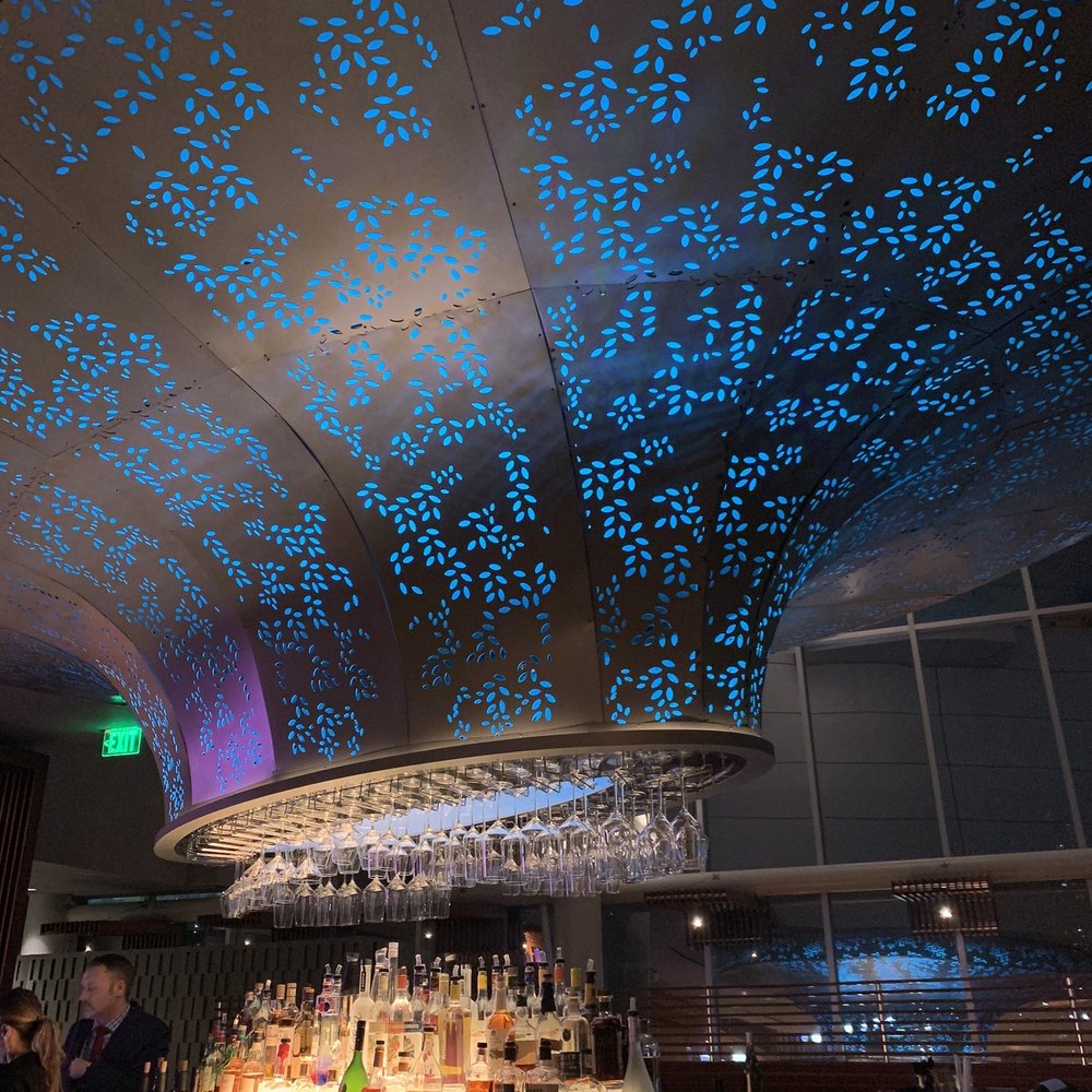 Prism - a bar with a lot of bottles on it - Seafood Near Me - Detroit, Michigan Prism - a bar with a lot of bottles on it - Seafood Near Me - Detroit, Michigan
