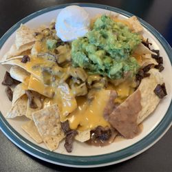 Tacos Del Sur - Absolutely the best nachos I have ever had. The guacamole is perfect. Better than mine. The beans are so rich and creamy.