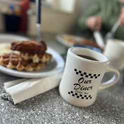 Our Diner - Our diner mug with chicken and waffles in the background